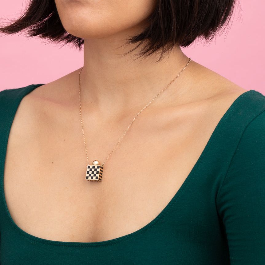 Rachel Quinn Jewelry small square 14k yellow gold and black checkered vessel box necklaces on gold chain worn on female model neck