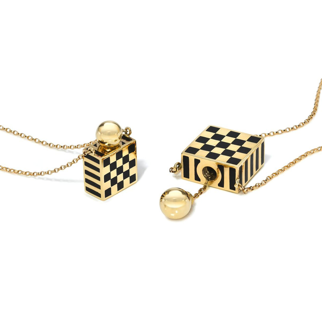 Rachel Quinn Jewelry small and large 14k yellow gold black checkered vessel box necklaces side by side on white background.