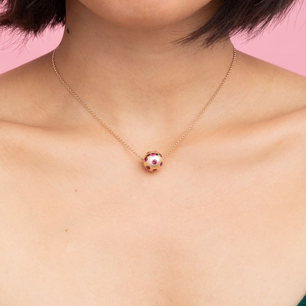 Rachel Quinn Jewelry Polka Dot Sphere Necklace magenta sapphires set all around on gold chain on female model neck