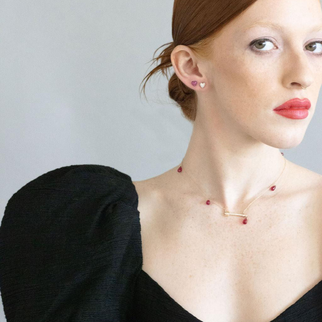 model wearing artemis necklace and sweet p earrings wearing a black formal dress