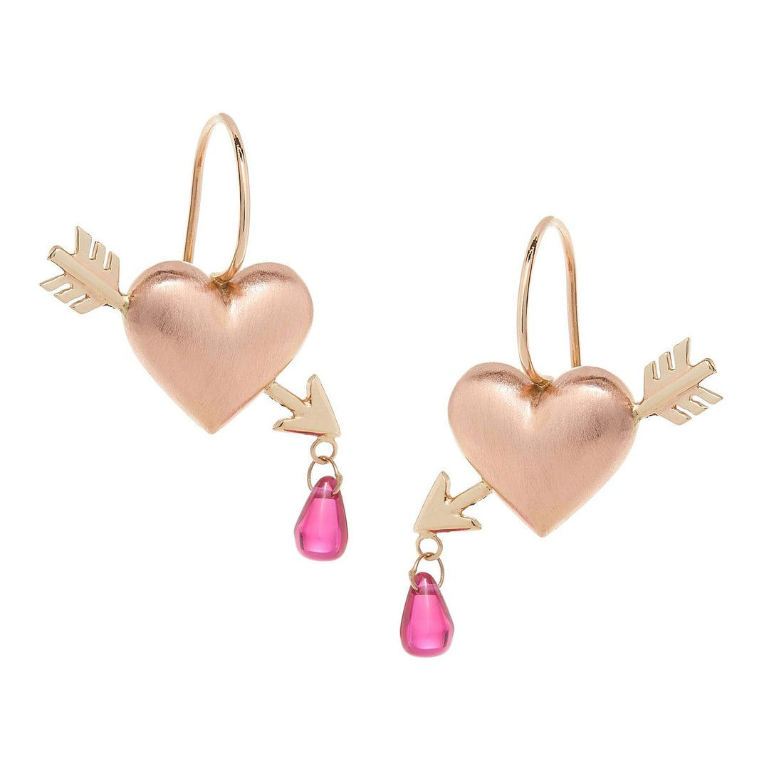 puff heart hook earrings in rose gold with yellow gold arrows piercing heart with lab grown rubies dripping from tip of arrow