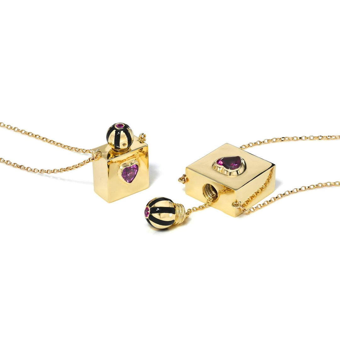 Rachel Quinn Jewelry 14k yellow gold square vessel box necklace small and large next to each other on white background.