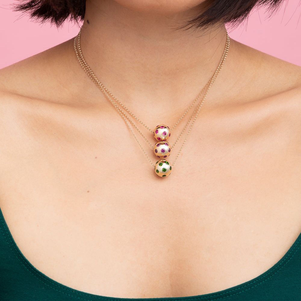 Rachel Quinn Jewelry Polka Dot Sphere Necklaces multiple color options shown stacked on female model neck.