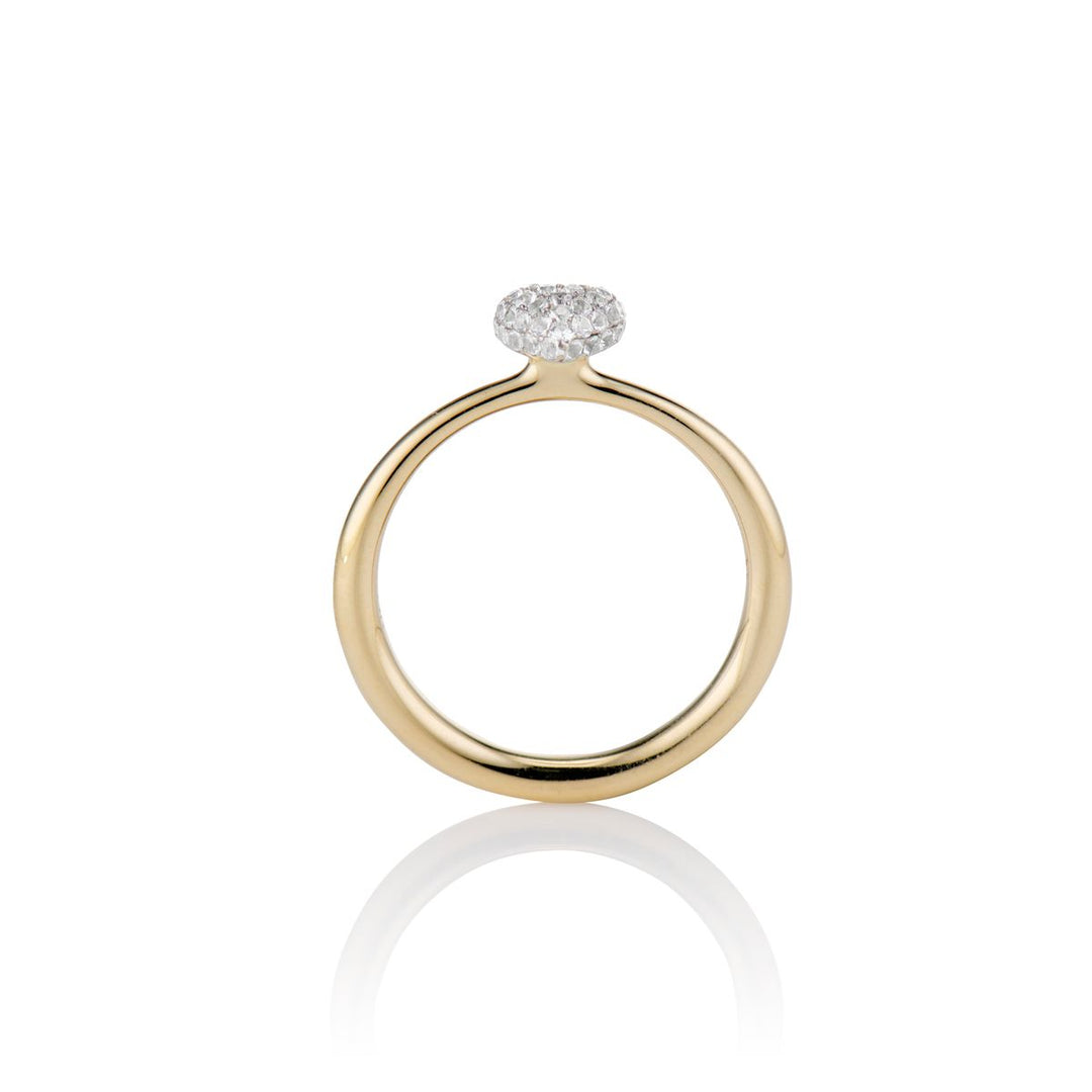 side shot of the sweet p heart ring white sapphire on a white background with a gold band