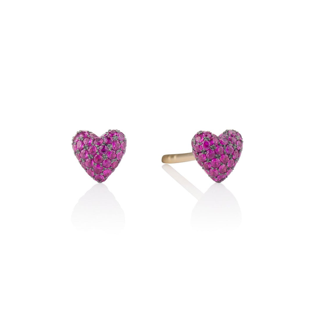 ruby heart studs on a white background