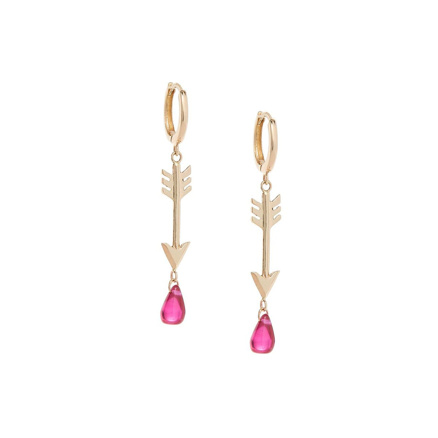 Yellow gold arrow earrings on closed hoops with pink ruby drops dripping from the arrow tips