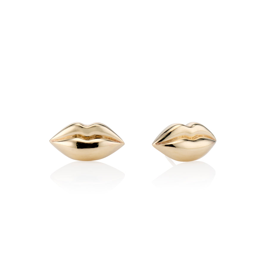 small gold lip studs on white background