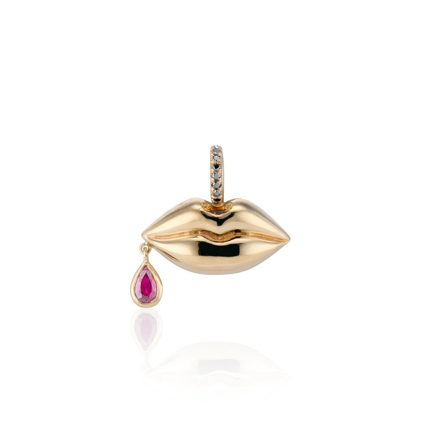 gold lips with red ruby dangling on side of mouth charm on white background