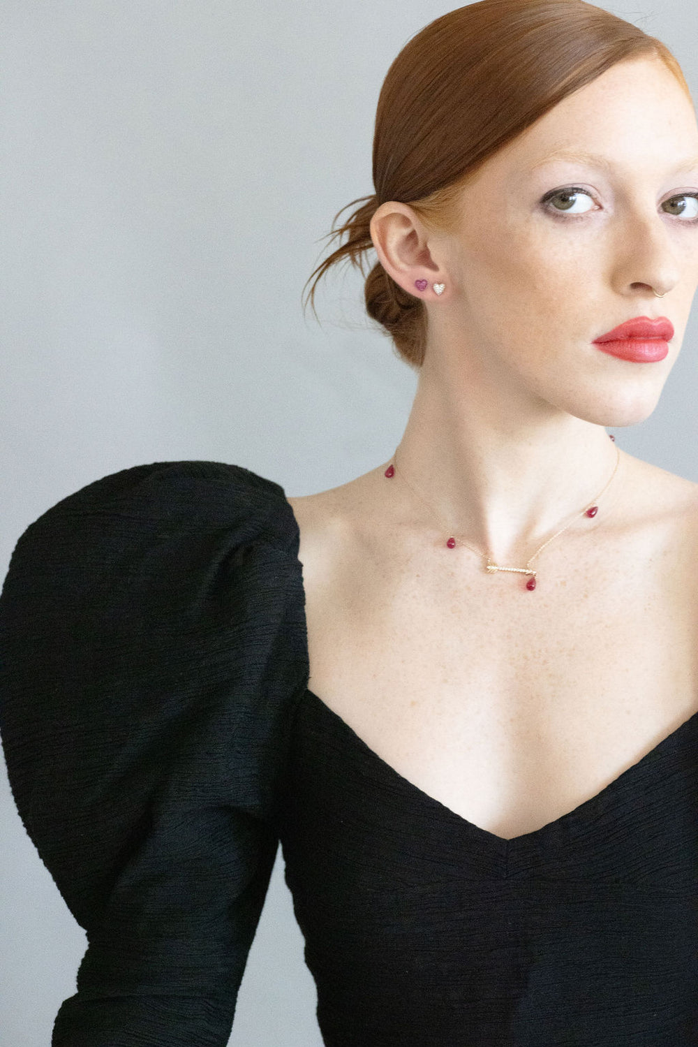 model wearing artemis necklace and sweet p earrings wearing a black formal dress