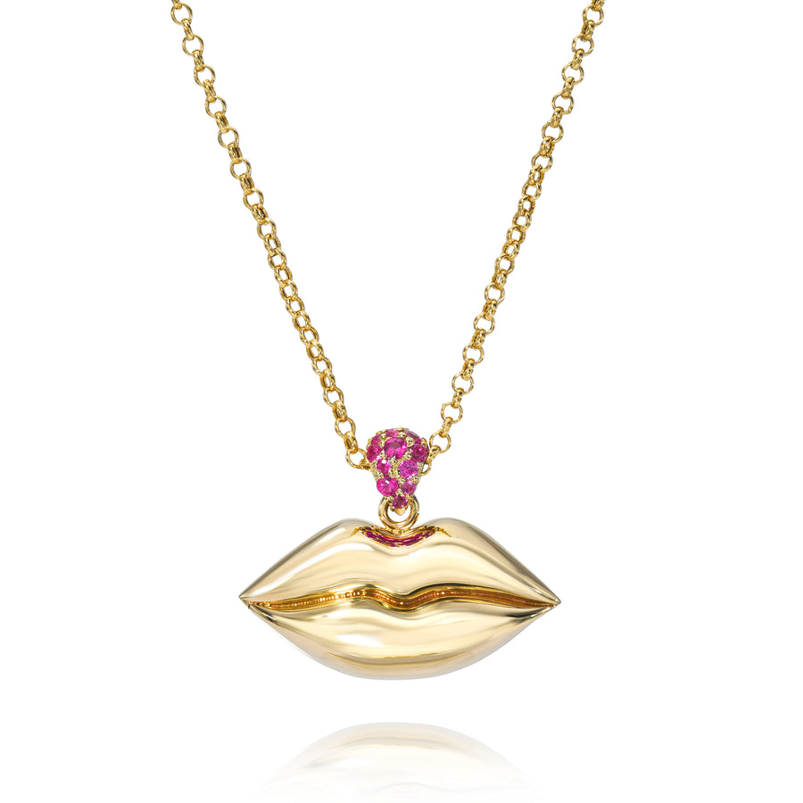 Large plump lips necklace in 14k yellow gold on gold chain with magenta sapphire bail on white background.