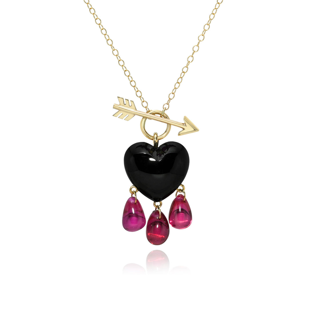 Necklace with black heart pendant, pink teardrop charms, and gold arrow on a white background