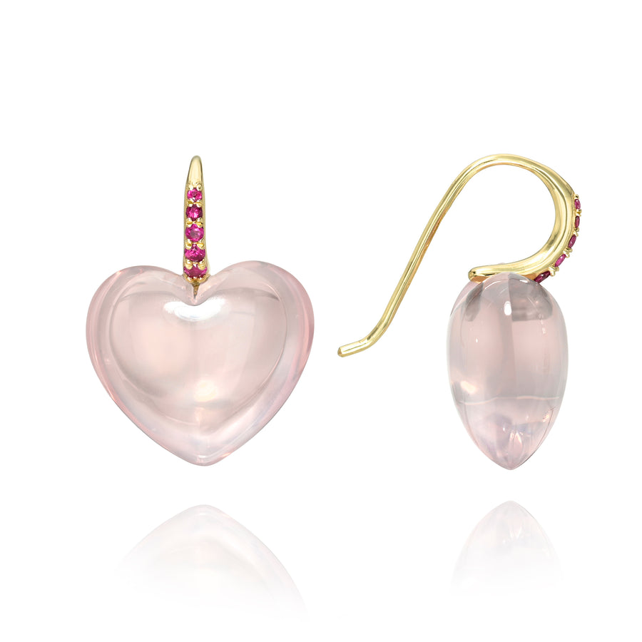 Pale pink rose quartz heart-shaped earrings by Rachel Quinn with deep pink sapphires set in the gold ear wires on a white background