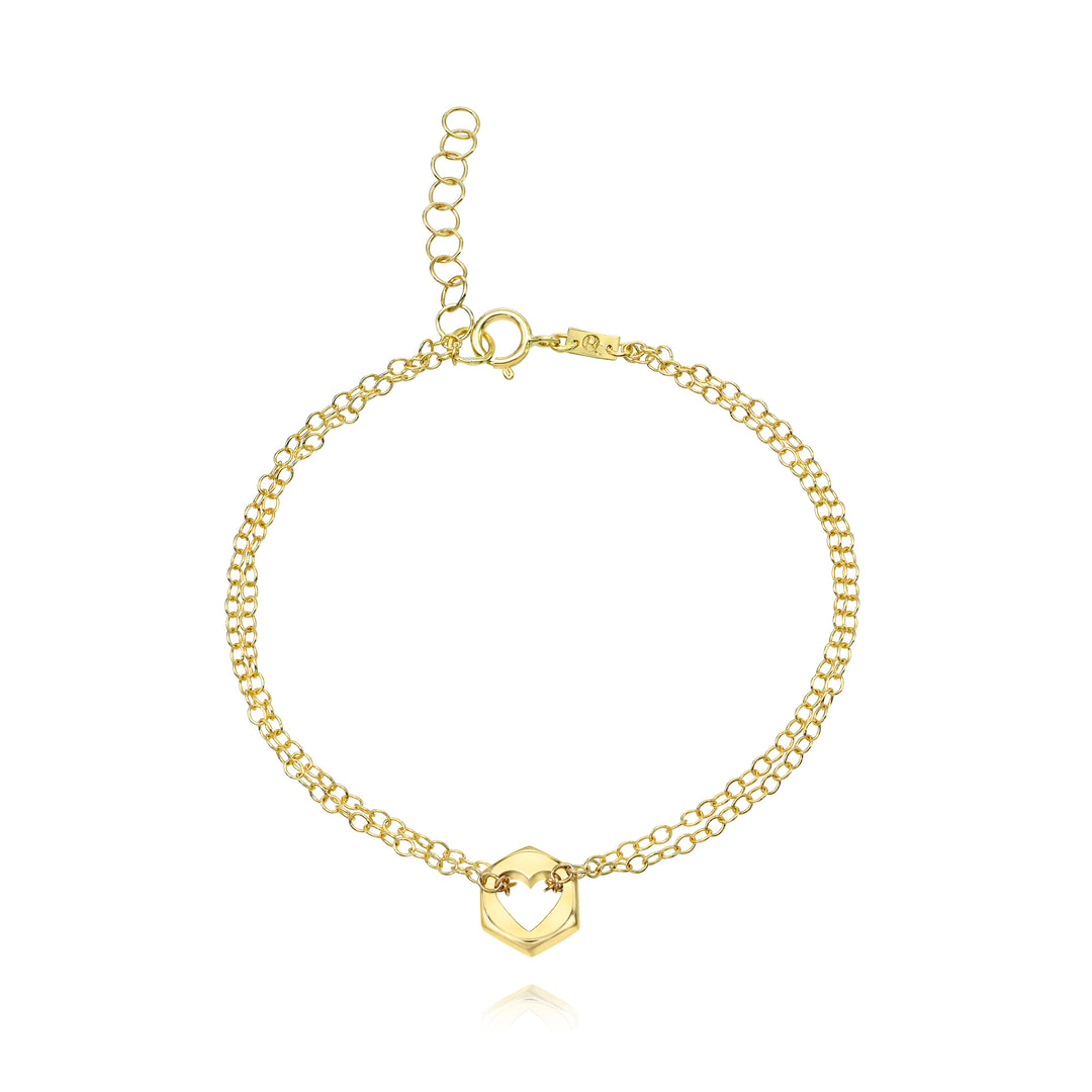 Gold bracelet with a hex nut charm with a heart cut in the center on a white background