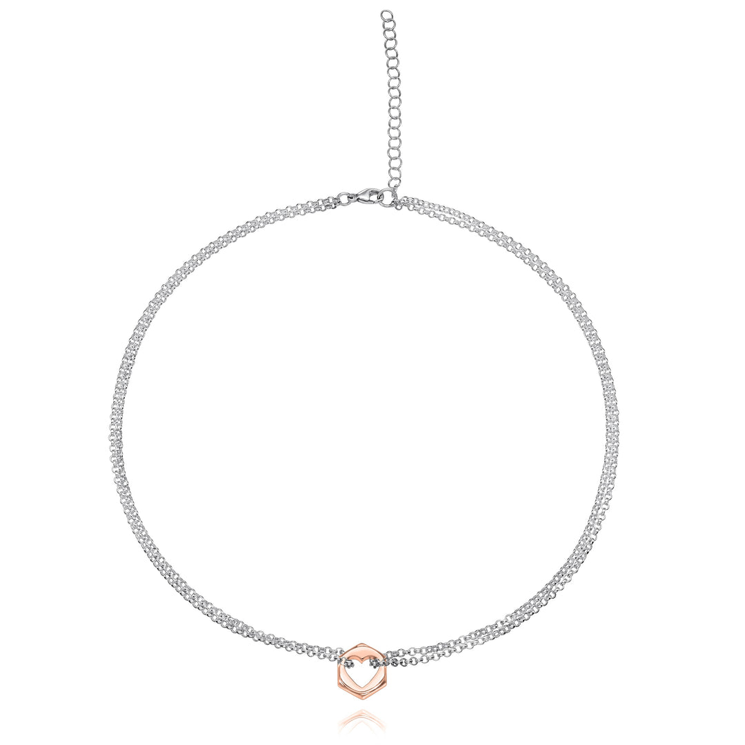 Rose gold hex nut pendant necklace with a heart-shaped cut out in center with silver chain looped through either side, on a white background
