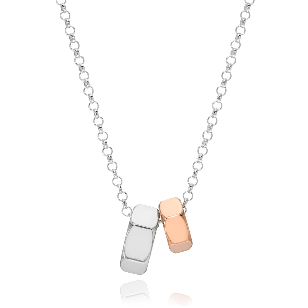 Silver chain necklace with two hex nut pendant charms, one silver and one rose gold, on a white background.