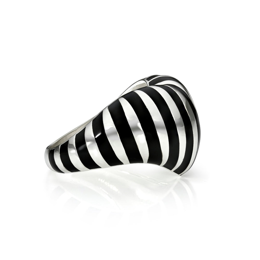 Side view of silver and black striped heart ring against a white background