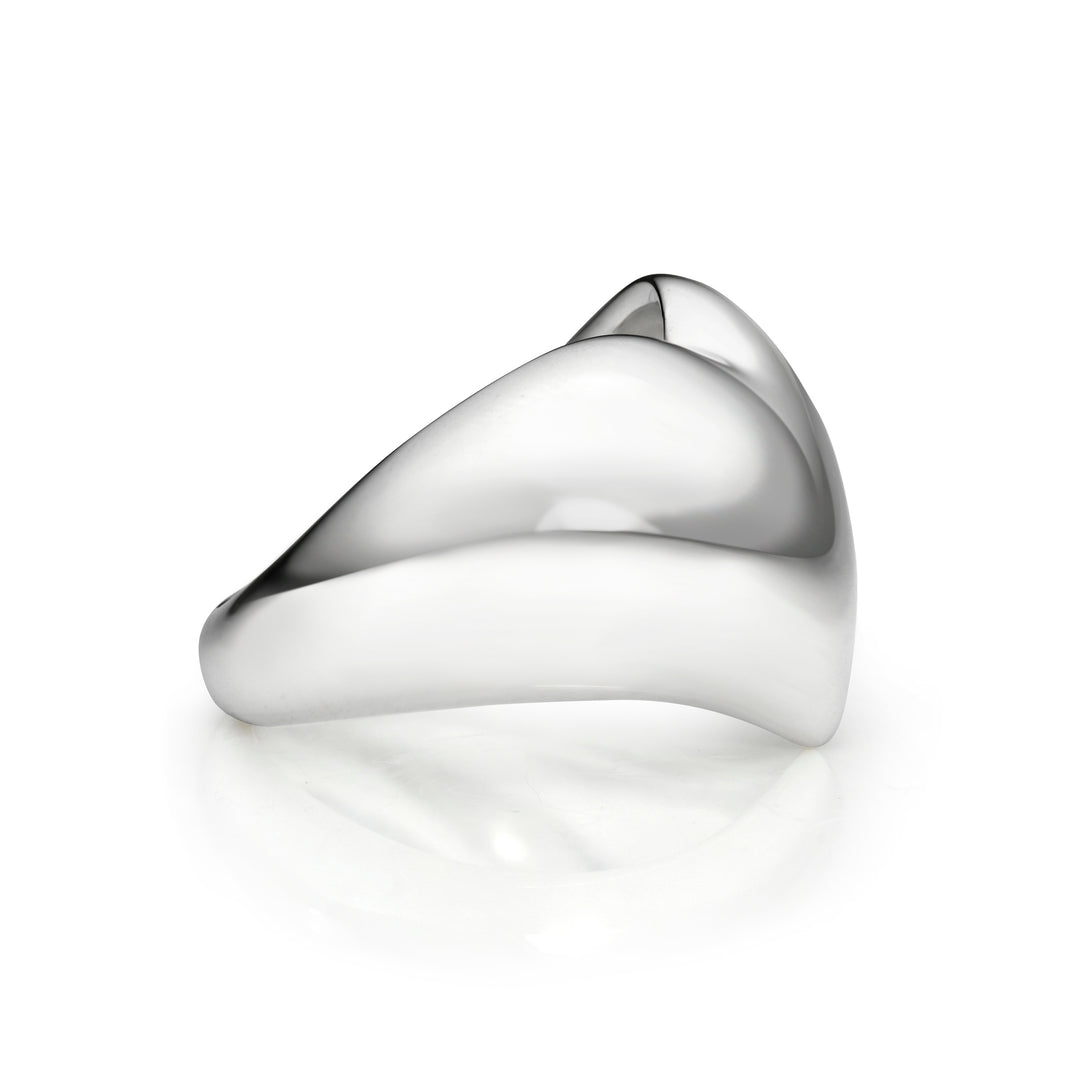 Side view of silver heart ring on a white background