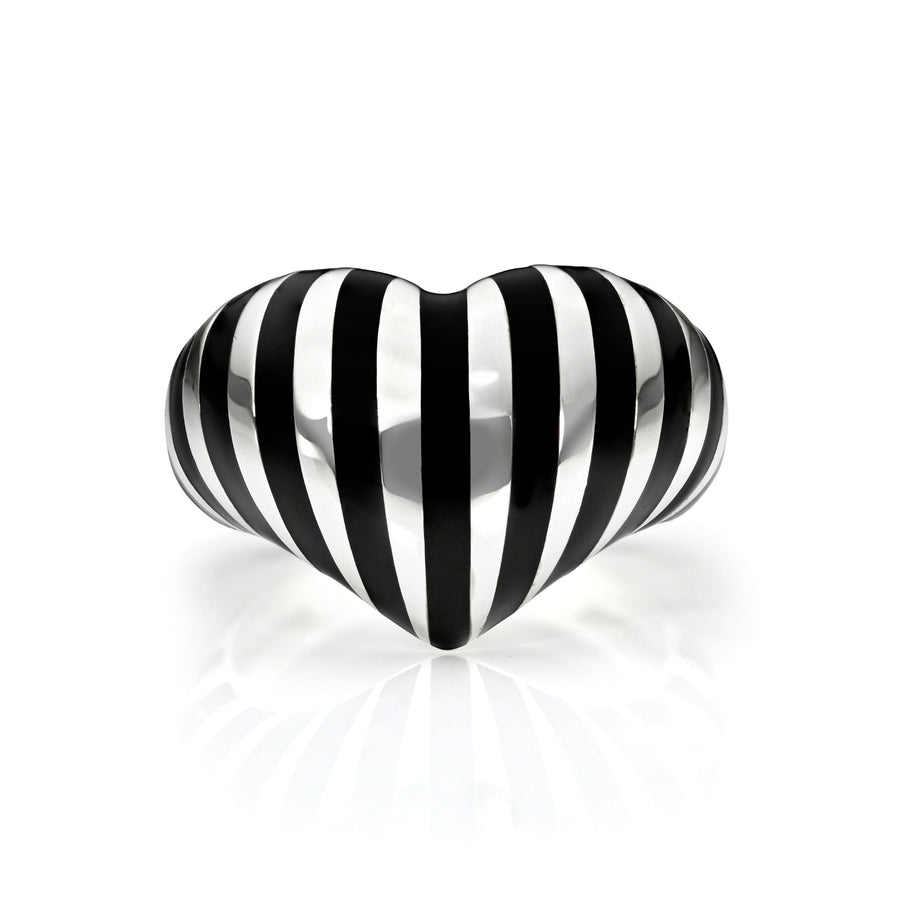 Silver heart ring with black stripes against  a white background