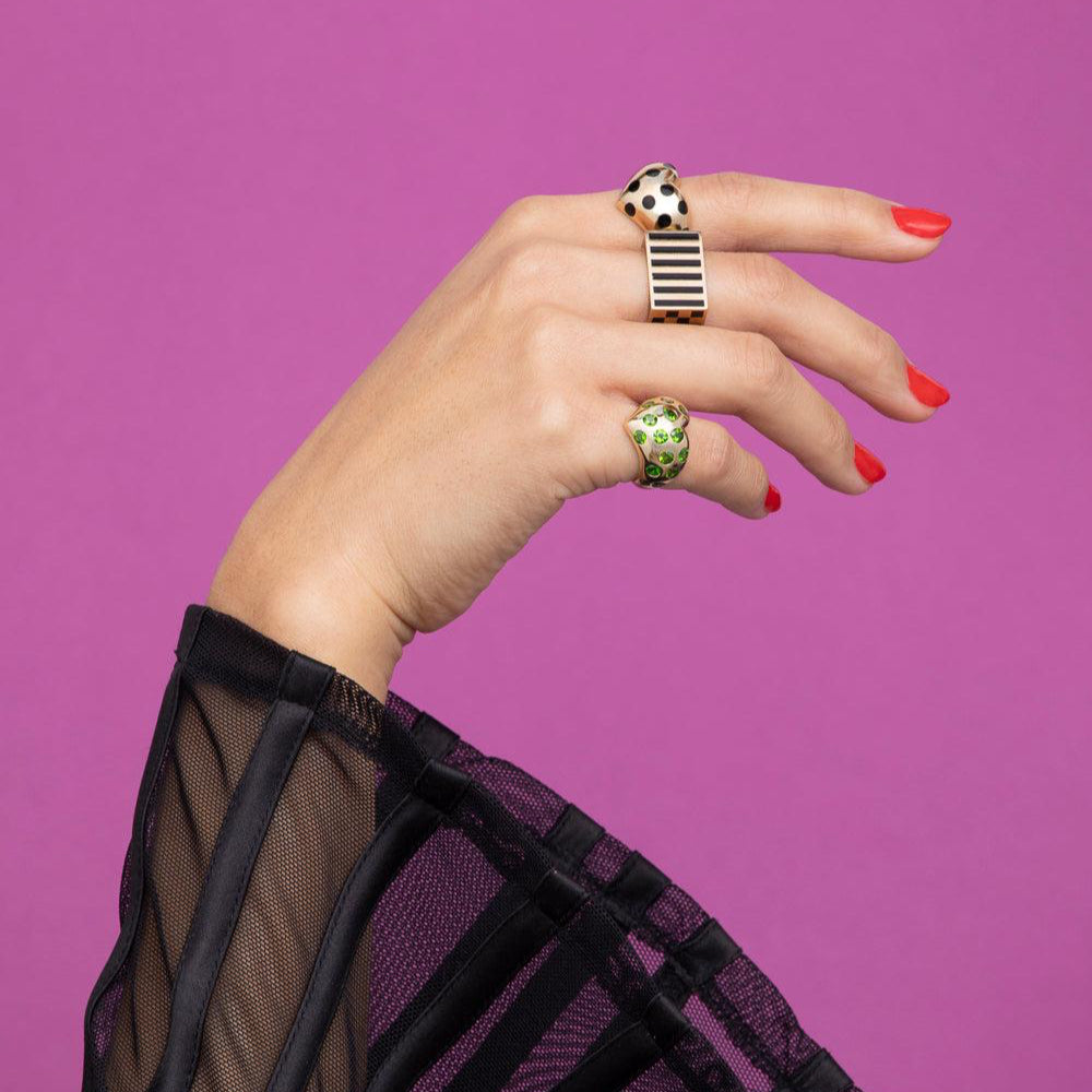 rachel quinn jewelry block ring in yellow gold and black shown on model hand