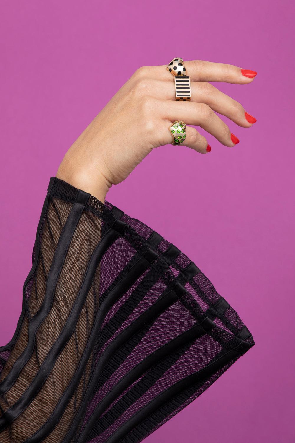 rachel quinn jewelry block ring in yellow gold and black shown on model hand