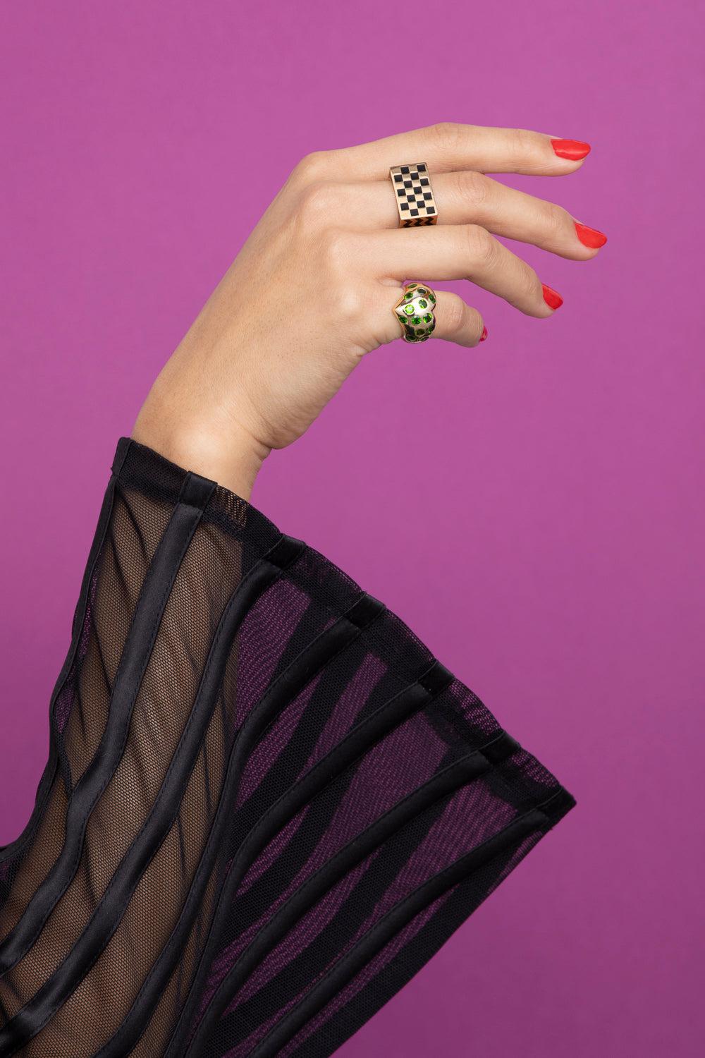 rachel quinn jewelry block ring in yellow gold and black shown on model hand