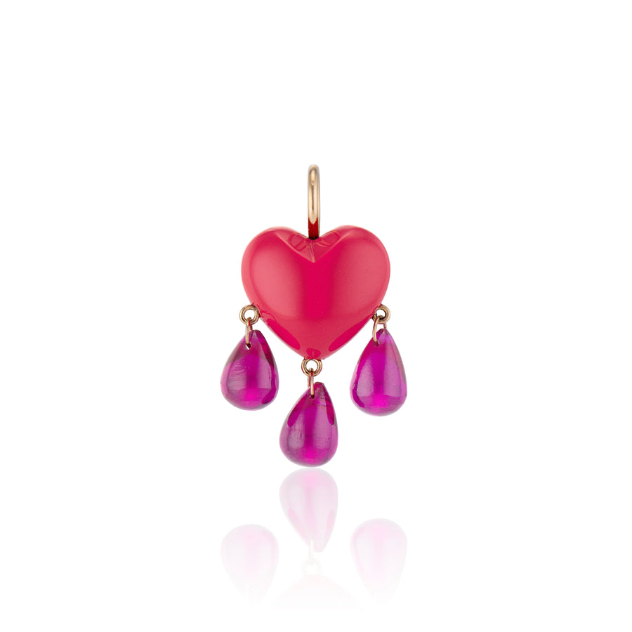 small smooth coral heart charm drips with a trio of ruby blood with yellow gold