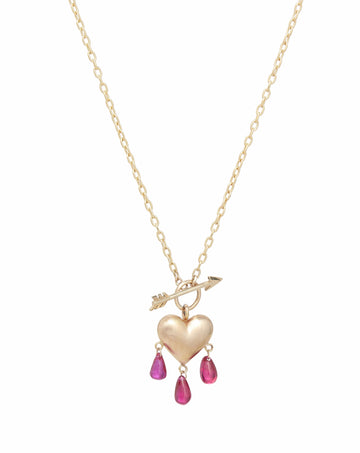 Yellow gold puffy heart on  elongated link chain with arrow in front and pink ruby droplets