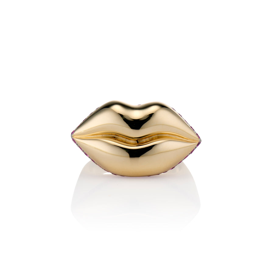 front shot of gold lip ring with ruby pave on a white background