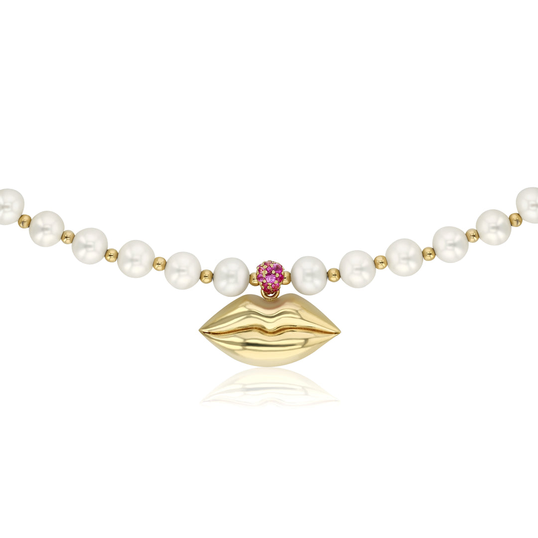 pearl necklace with a sparkling bail of magenta sapphires to add an extra pop of color