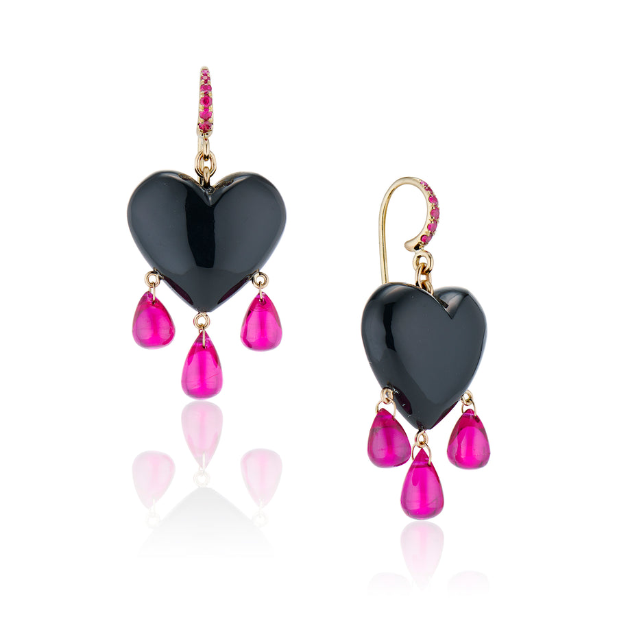 black heart earrings with three rubies dangling and rubies in gold earring hook on a white background