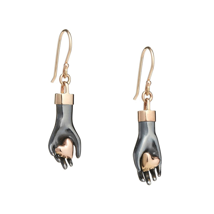Sterling silver hand earrings gently hold a pair of 14K solid rose gold hearts. Wrist cuff and ear wires are made of yellow gold