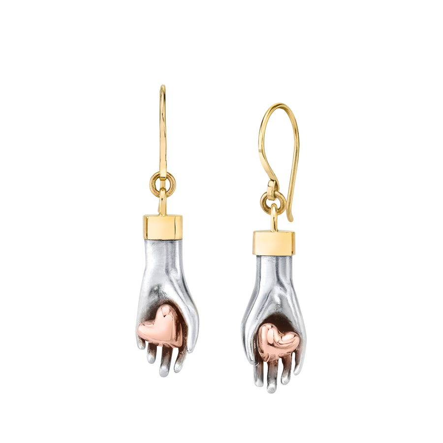 Sterling silver hand earrings gently hold a pair of 14K solid rose gold hearts with a yellow bail and ear wires
