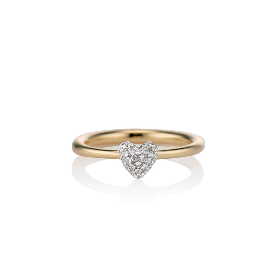 zoomed in shot of the sweet p heart ring white sapphire on a white background with a gold band