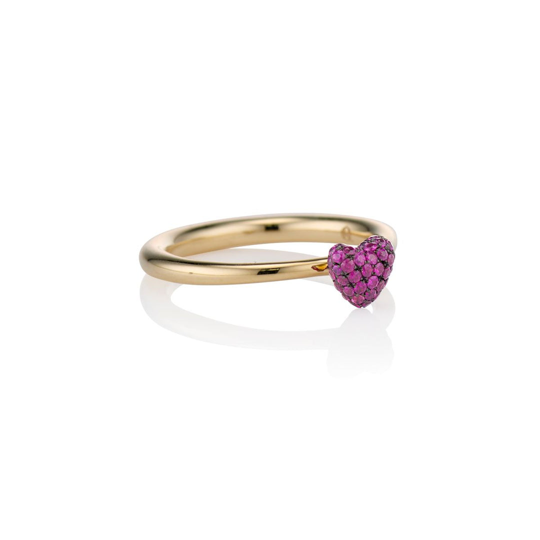 angled shot of the sweet p heart ring ruby on a white background with a gold band