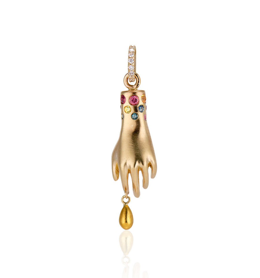 back view of hand charm with single diamond in the palm, solid gold drip from pointer finger, gemstones around the wrist and white diamonds on the bail