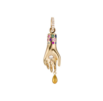 hand charm with single diamond in the palm, solid gold drip from pointer finger, gemstones around the wrist and white diamonds on the bail