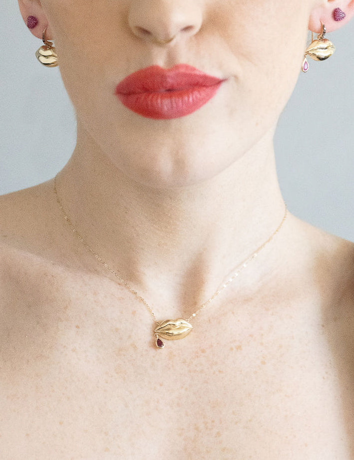 lass kiss earrings and necklace on model